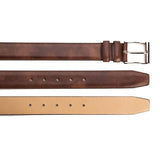 Meermin cognac museum calf belt, three angles shown: buckle end, tail with holes, and reverse tan leather lining