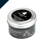 Famaco Crème de Beauté shoe cream tin, angled close-up showing screw-top lid and side label with beeswax and shine icons