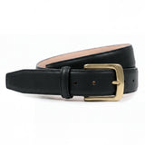 Meermin black waxy calf belt, coiled to show solid brass buckle and pink veg-tanned leather lining along the edge