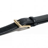 Meermin black waxy calf belt, close-up on solid brass buckle and keeper loop, showing leather grain and stitched edge detail