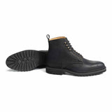 Meermin black waxy commander Service boots, paired sole-up and side profile, showing cleated rubber sole and lace-up vamp